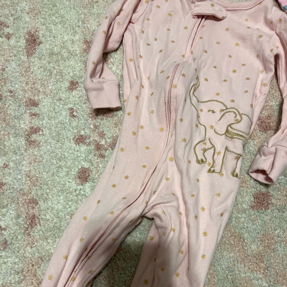 12 months. Carter’s. Footie pajamas. Zip up. Used condition.